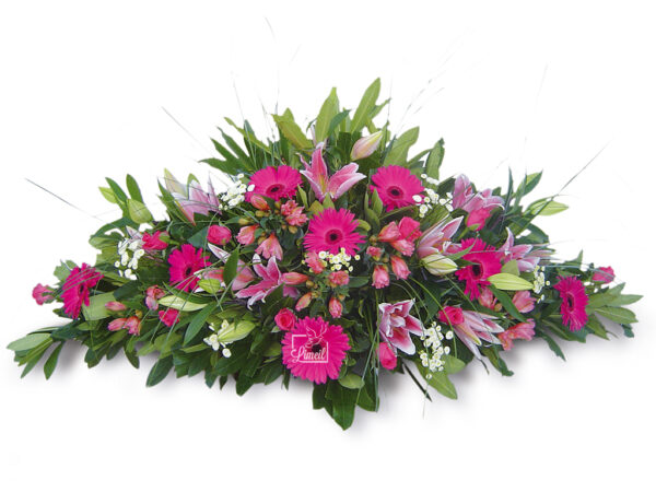 Raquette de fleurs multicolore, dominante rose proposée par les pompes funèbres loic